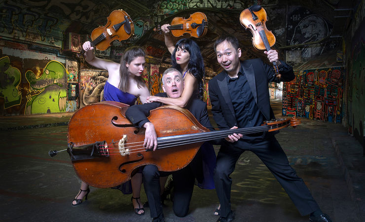 4 musicians all waving their instruments