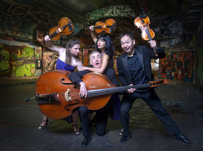 4 musicians all waving their instruments